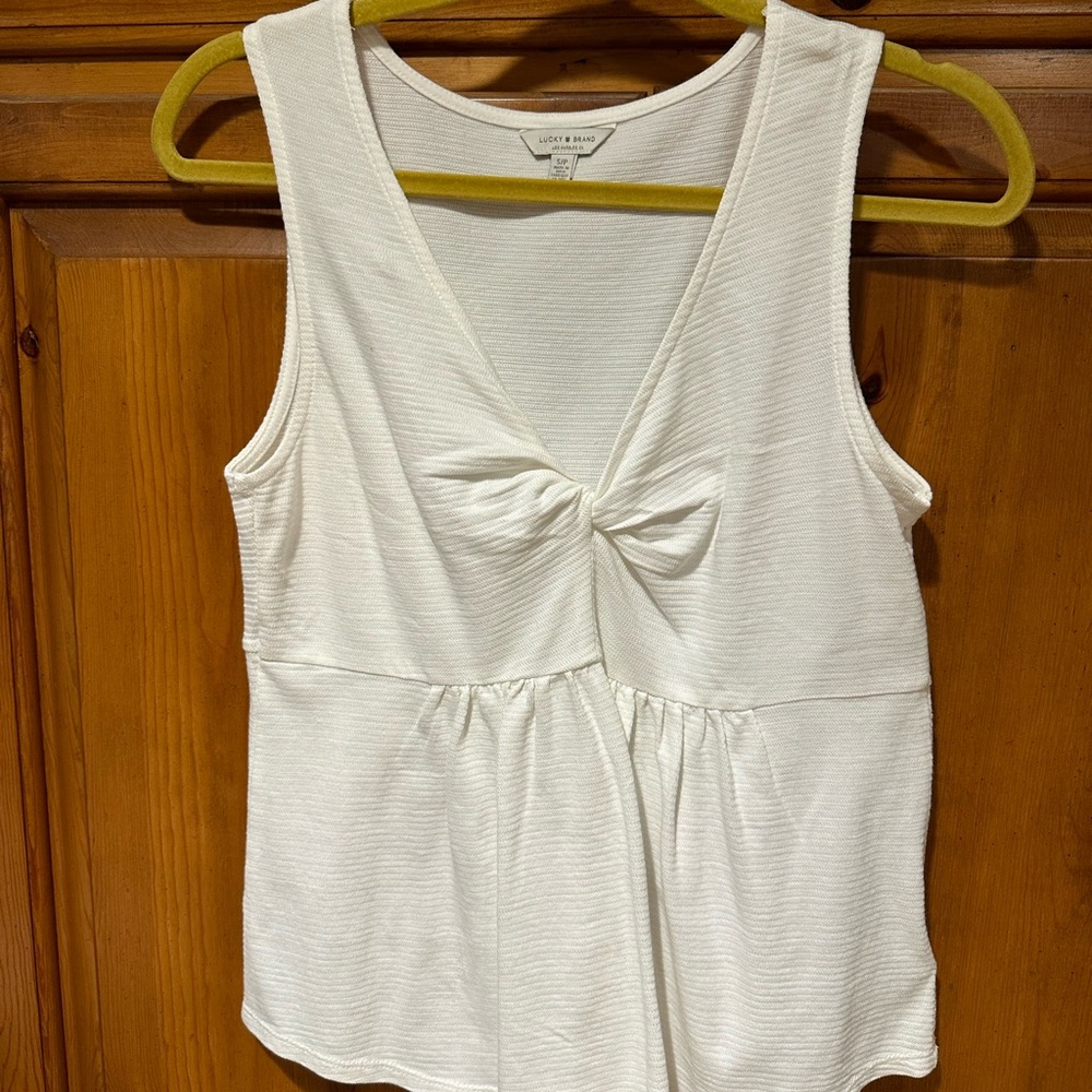 Lucky small sleeveless top worn once…wonderfull condition!